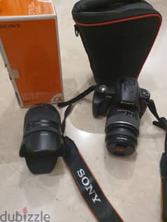 Sony Alpha 230 camera with 2 lenses