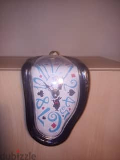Melting clock inspired by the art of Salvador Dali. decorative clock 0