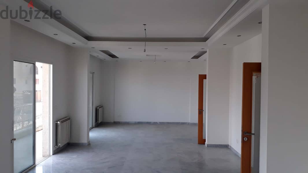 L04976 - Spacious Apartment For Sale in Qornet El Hamra with View 1