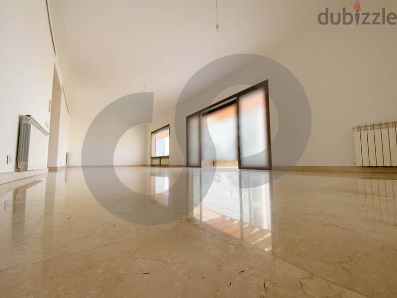 This spacious, well-lit apartment in Horsh Tabet   REF#SB97412 1