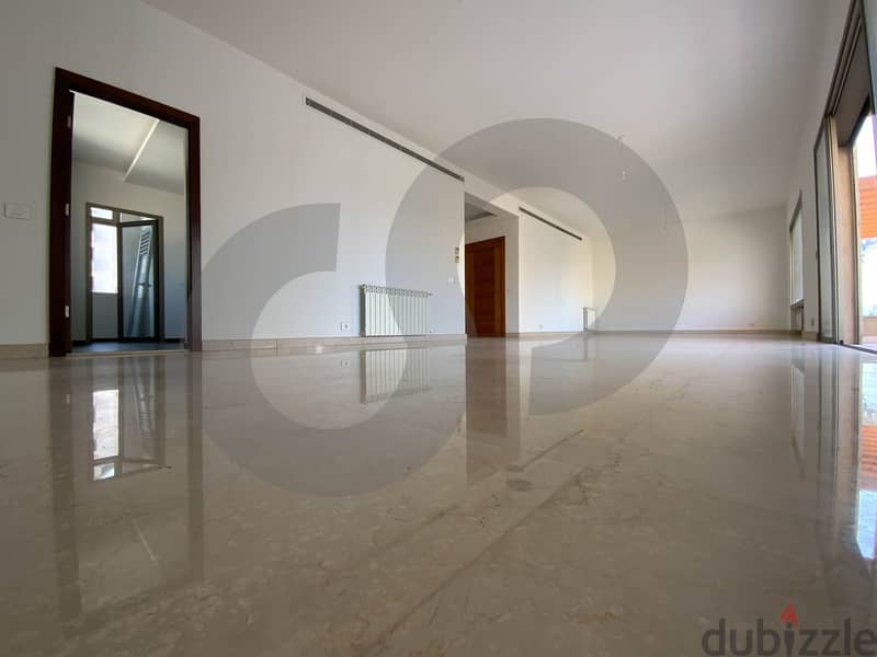 This spacious, well-lit apartment in Horsh Tabet   REF#SB97412 2