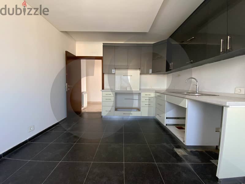 This spacious, well-lit apartment in Horsh Tabet   REF#SB97412 5
