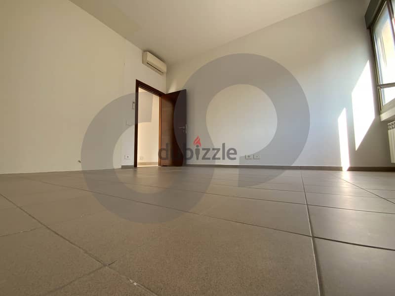This spacious, well-lit apartment in Horsh Tabet   REF#SB97412 9