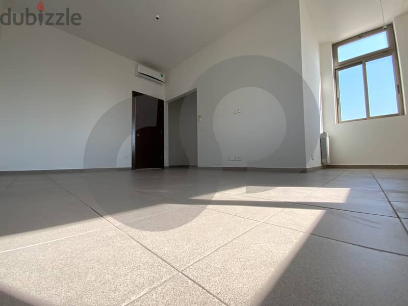 This spacious, well-lit apartment in Horsh Tabet   REF#SB97412 11