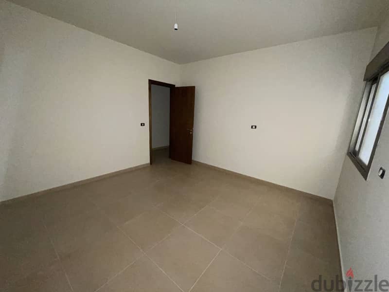 RWK163JS - Apartment For Sale In Ballouneh - شقة للبيع في بلونة 5