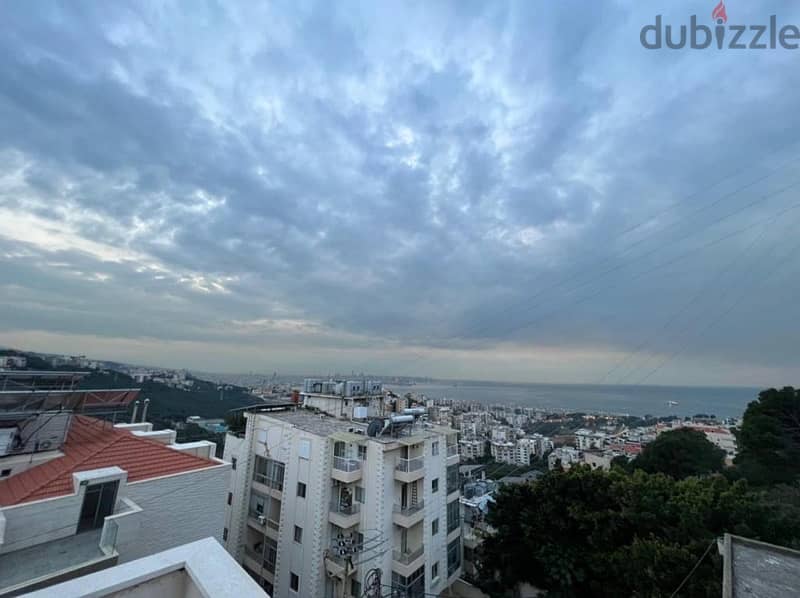 A furnished rooftop apartment with terrace and open views in Awkar. 1