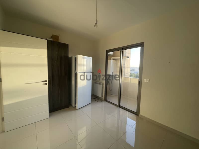 RWK169JS - Apartment For Rent in Ballouneh - شقة للإيجار في بلونة 4