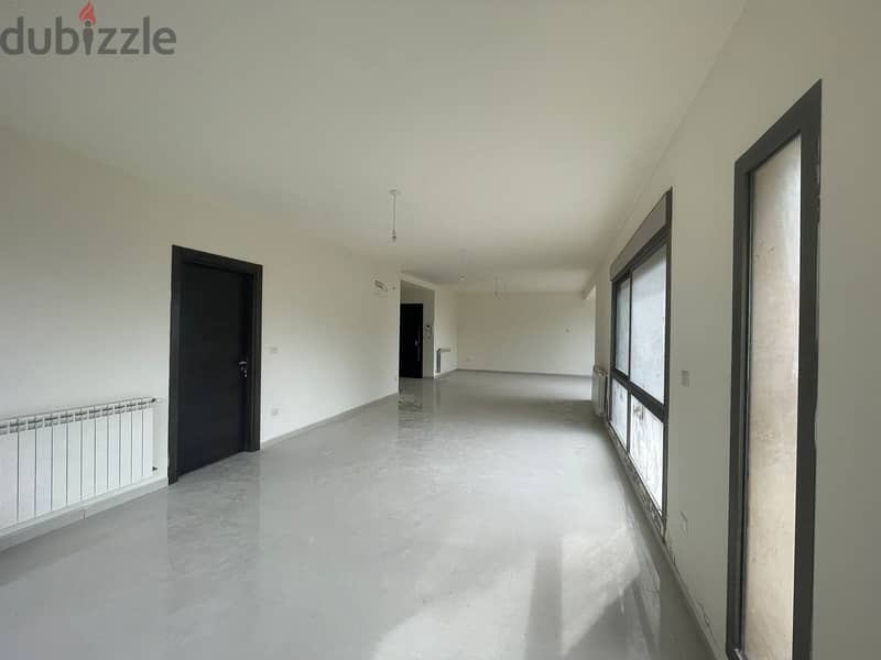 RWK170JS - Apartment For Sale in Ballouneh - شقة للبيع في بلونة 2