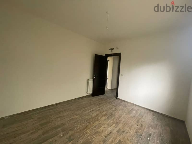 RWK170JS - Apartment For Sale in Ballouneh - شقة للبيع في بلونة 7