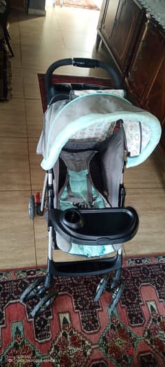 2 strollers with a car seat