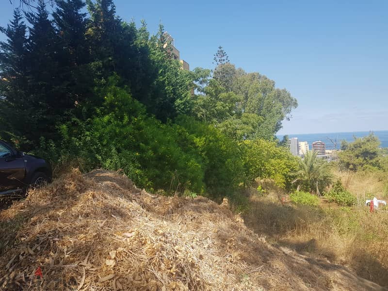 A 900 m2 land having an open sea view for sale in Aoukar 1