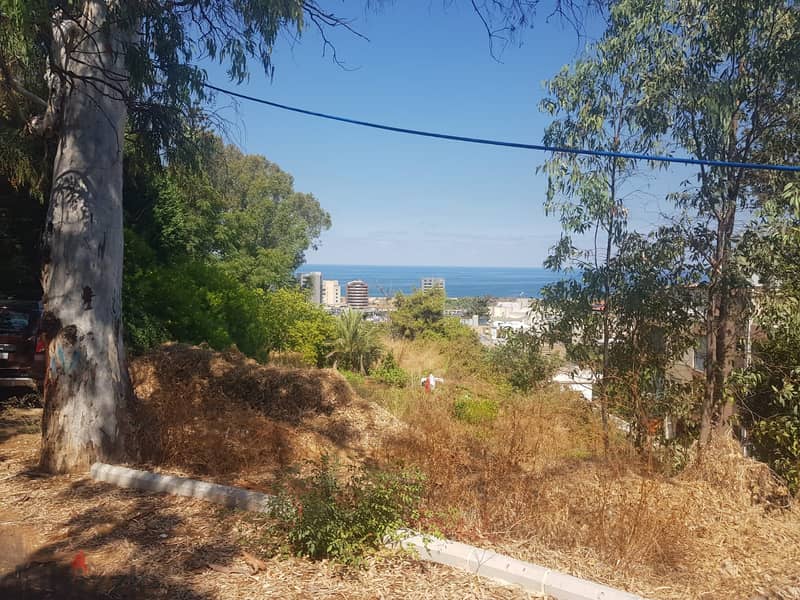 A 900 m2 land having an open sea view for sale in Aoukar 2