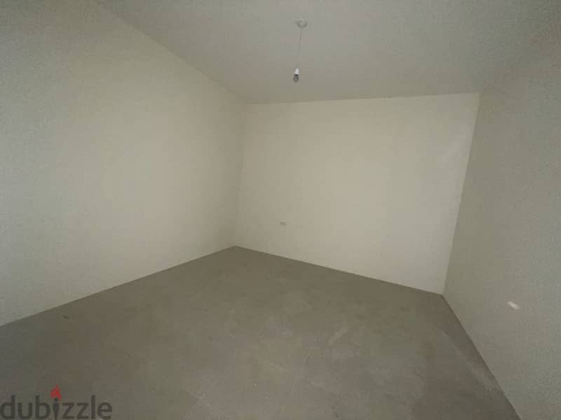 RWK176JS - Apartment For Sale in Ballouneh - شقة للبيع في بلونة 2