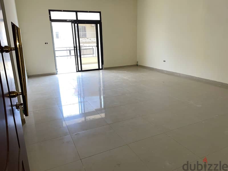 A 120 m2 apartment having an open mountain view for sale in Qlayaat 1