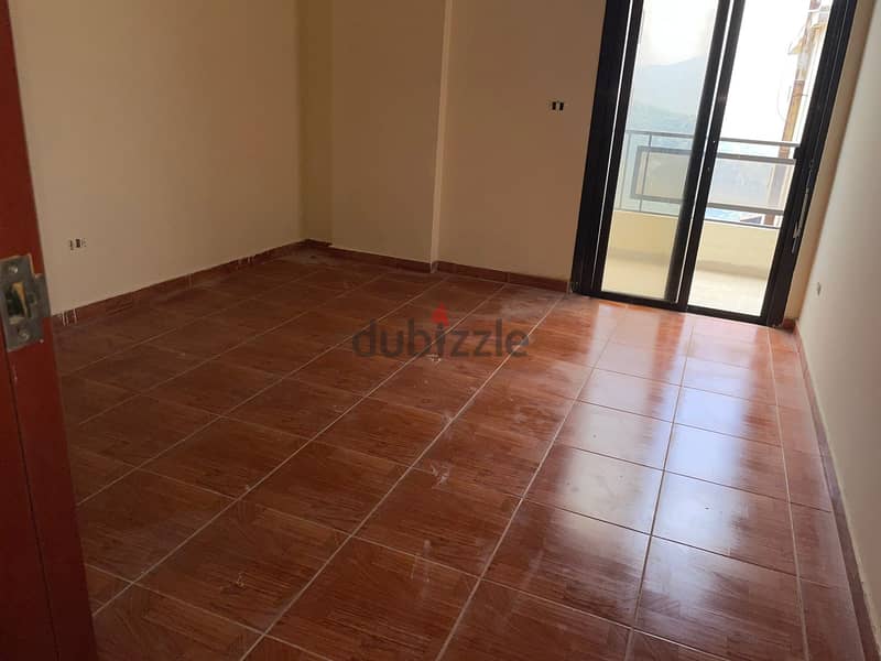 A 120 m2 apartment having an open mountain view for sale in Qlayaat 4