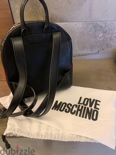 Real leather Moschino hand and backbag