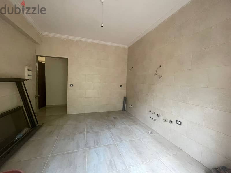 RWK130JS - Apartment For Sale in Ballouneh - شقة للبيع في بلونة 5