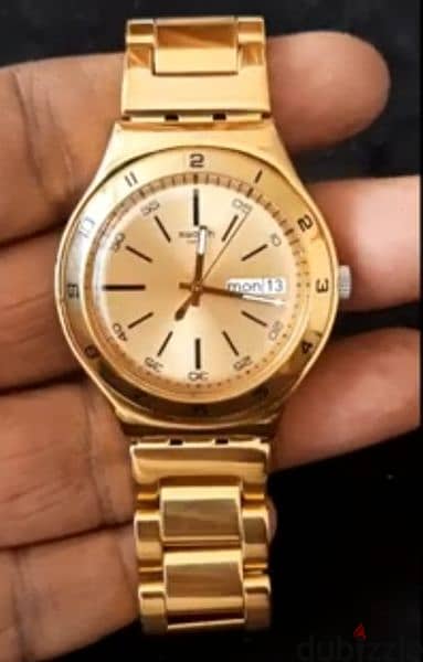 Swatch women's gold discount watch