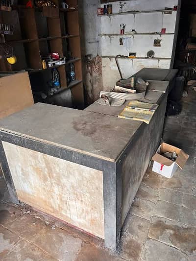 PLAIN WOOD SHELVES &  CARRARA MARBLE TABLE.