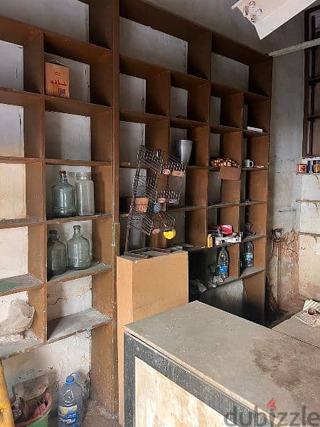 PLAIN WOOD SHELVES &  CARRARA MARBLE TABLE. 1