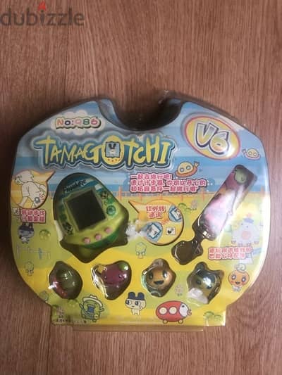 90’s Japanese v6 TAMAGOTCHI pet ready to feed and grow تاماغوتشي