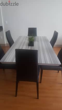 Marble dining table and leather chairs