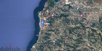 A 4600 m2 land + open sea view for sale in Batroun Highway