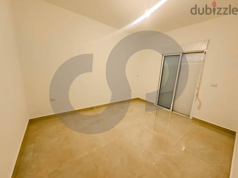 A 120-square-meter apartment in KOURA/الكورة REF#TI100378 4