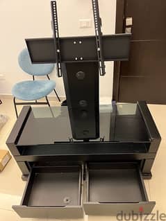Rotating TV unit with drawers and cable ma