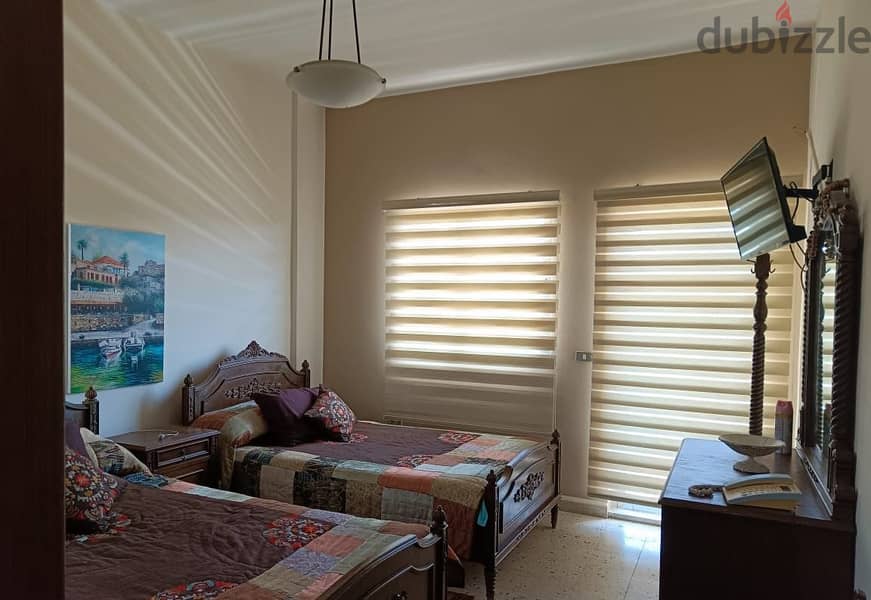 FURNISHED apartment for rent in AMCHIT/JBEIL, with a mountain view. 4