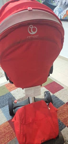 stroller red color (stokke)  &park cam& bath cam for babies. 1