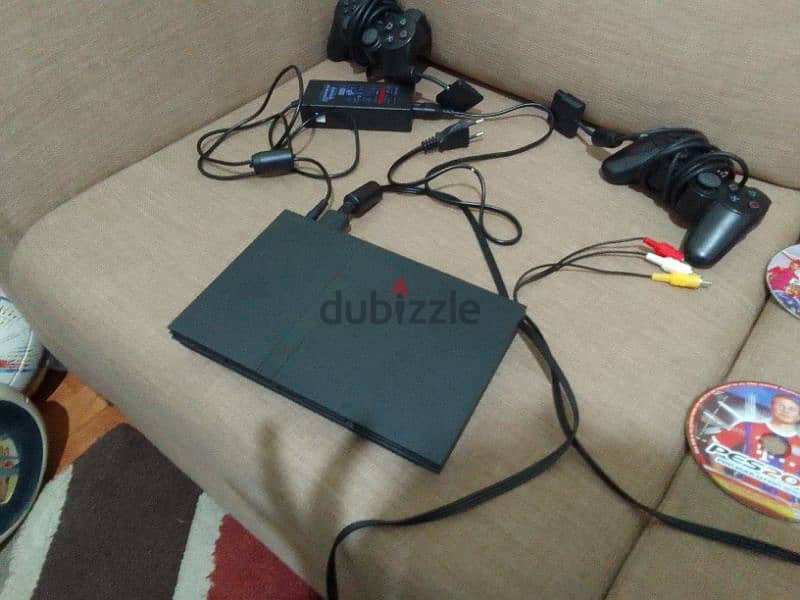 Ps2 with 2 controllers with 13 CD 1