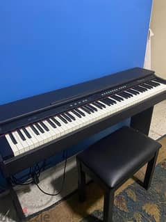 wooden electric Piano, with bench and peddles, used like new .