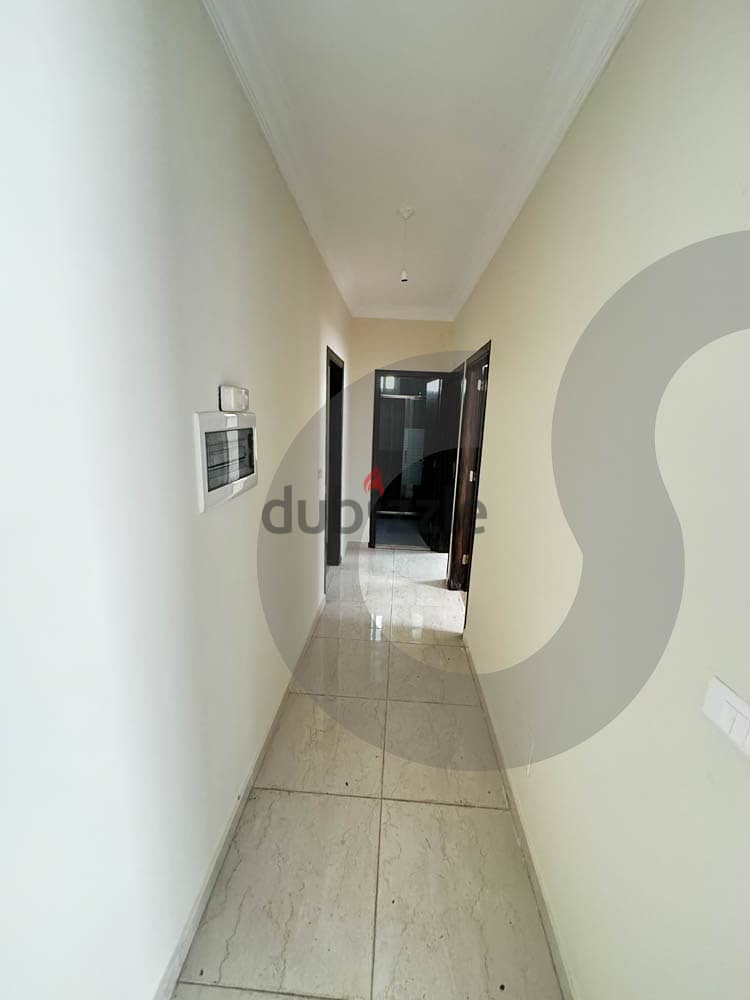 well-maintained apartment is for sale in Amchit/عمشيت REF#NE102267 2