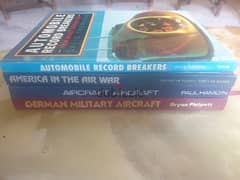 4 books with hardcover about aircraft and automobile