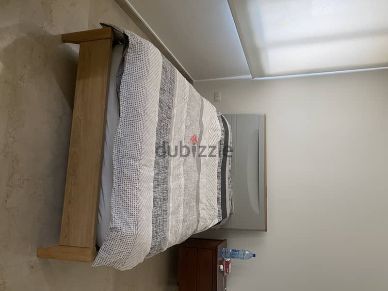Best priceBed grey incolor in very good condition with a free mattress 1