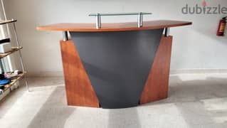wood and glass reception desk 0