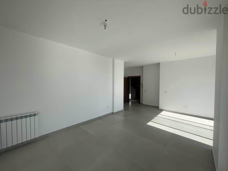 RWK237JS - Apartment For Sale In Ballouneh - شقة للبيع في بلونة 3
