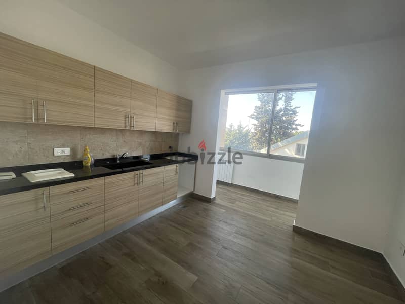 RWK237JS - Apartment For Sale In Ballouneh - شقة للبيع في بلونة 4