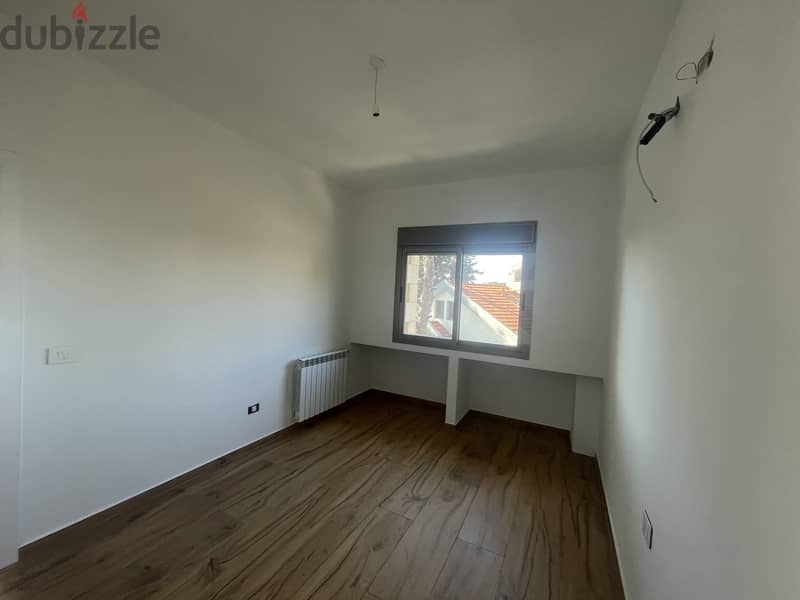 RWK237JS - Apartment For Sale In Ballouneh - شقة للبيع في بلونة 9