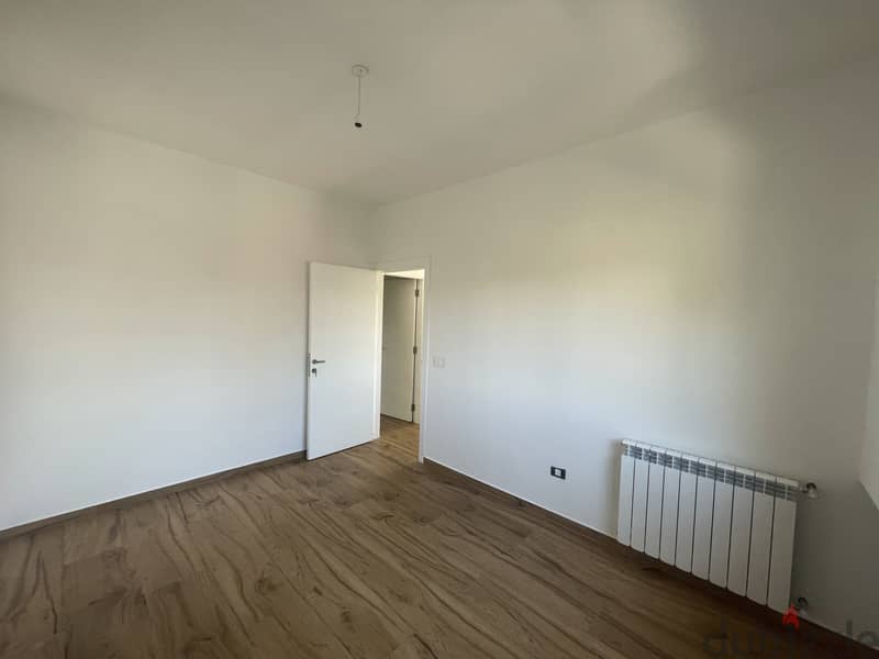 RWK237JS - Apartment For Sale In Ballouneh - شقة للبيع في بلونة 10