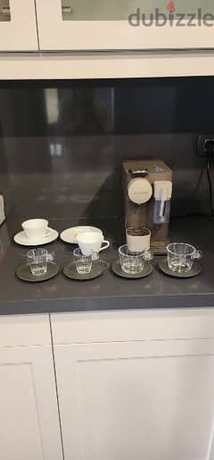 Nespresso "Latissima One" coffee machine with coffee cups