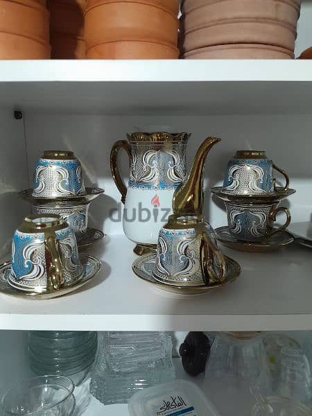 Tea cups  with thier plates and kettle 2