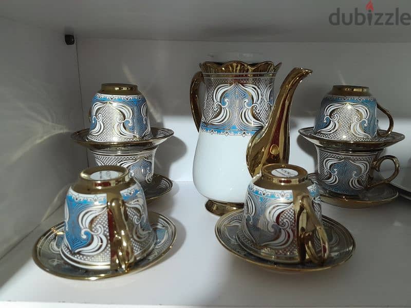 Tea cups  with thier plates and kettle 3