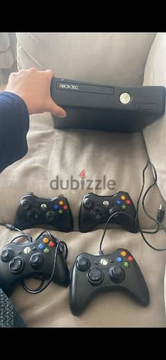 xbox 360 with 4 controlers and 80 games