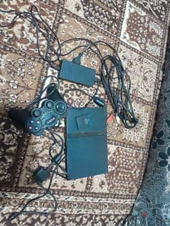 ps2 for selling. . . . used with cables adapter new and 1 controller
