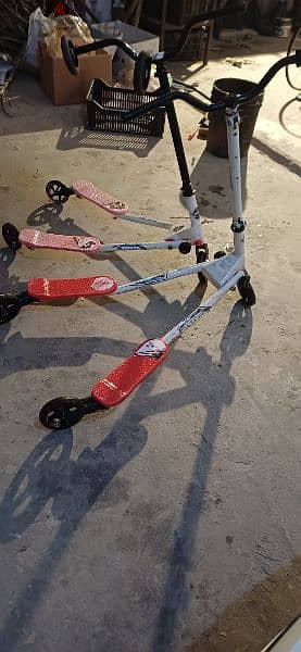 2 scooters and 2 extra tires 3