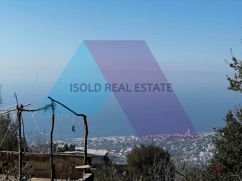 A 1015 m2 land having an open sea view for sale in Ghosta 1