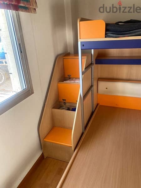 Two beds + working space + stair storage 1