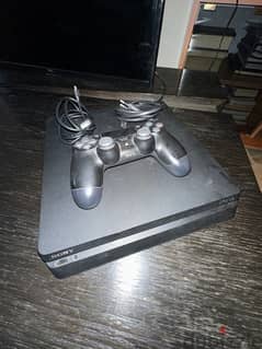 PlayStation 4 Slim 500GB with a controller